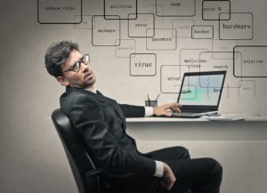 Man stressed out at his laptop